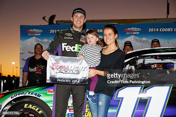 Denny Hamlin, driver of the FedEx Ground Toyota, his girlfriend, Jordan Fish, and his daughter, Taylor James Hamlin, pose with the Coors Light Pole...