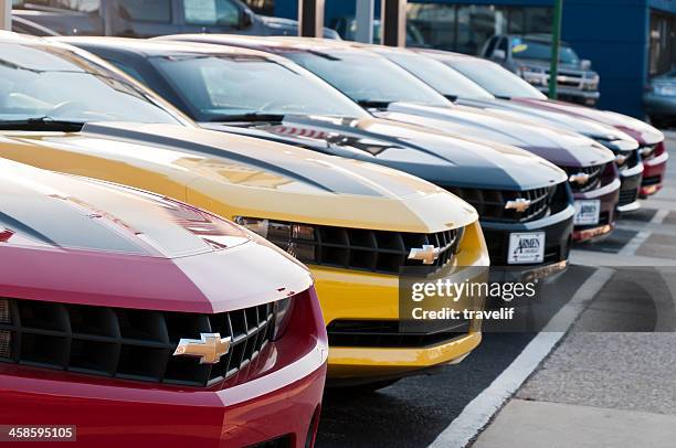 row of new chevrolet camaro cars on display - chevrolet camaro stockfoto's en -beelden