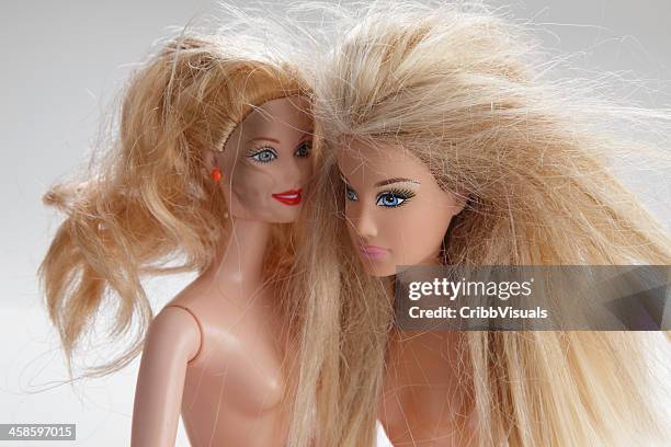 two barbie dolls on white - barbie dolls stock pictures, royalty-free photos & images