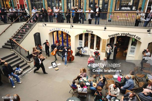 street musicians in covent garden - busker stock pictures, royalty-free photos & images