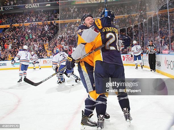 Drew Stafford of the Buffalo Sabres celebrates his third period goal with teammate Nicolas Deslauriers against the Edmonton Oilers on November 7,...