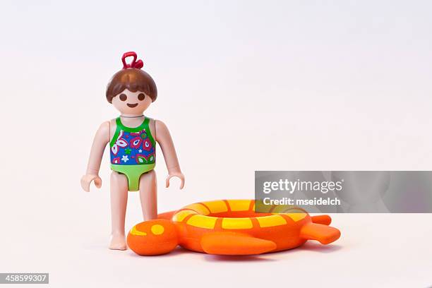 playmobil girl in bathing suit - playmobil stock pictures, royalty-free photos & images