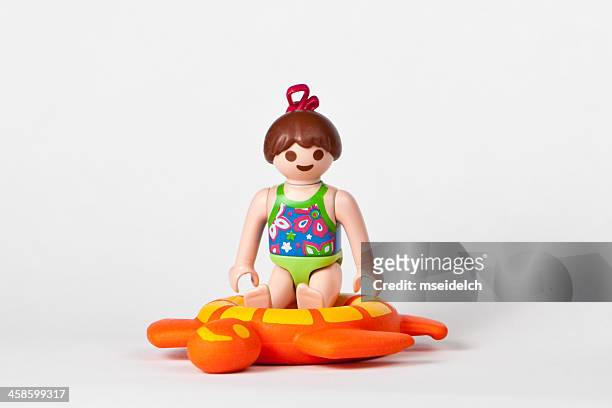 playmobil girl in bathing suit - playmobil stock pictures, royalty-free photos & images