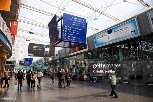 railway station concourse and information boards - piccadilly stock pictures, royalty-free photos & images