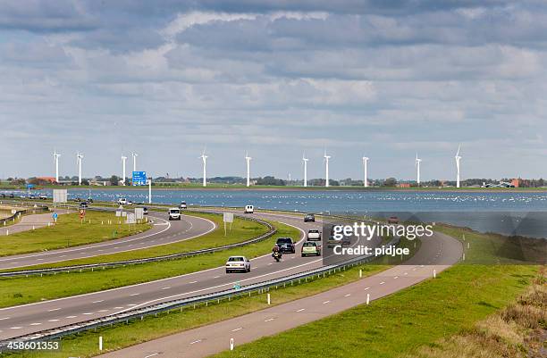 traffic on afsluitdijk the netherlands - ijsselmeer stock pictures, royalty-free photos & images