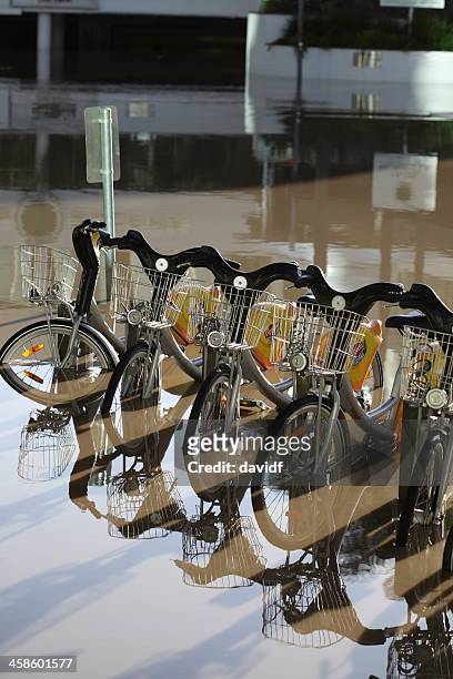 flooded bicycles - queensland flood stock pictures, royalty-free photos & images