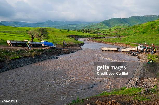 trucks fording a river in ethiopia - fording a river stock pictures, royalty-free photos & images