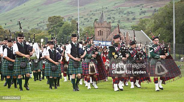 massed pipe bands at brodick highland games, arran. - the 2011 braemar highland games stock pictures, royalty-free photos & images