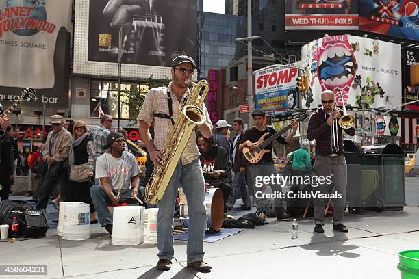 jazz musicians perform in times square - street performer stock pictures, royalty-free photos & images