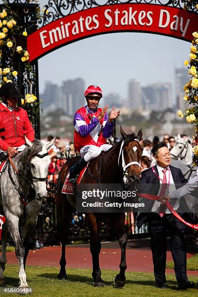 Dom Tourneur riding Hucklebuck returns to scale after winning race 7, the Emirates Stakes on Stakes Day at Flemington Racecourse on November 8, 2014...