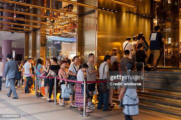 gucci flagship store - tsim sha tsui stock pictures, royalty-free photos & images