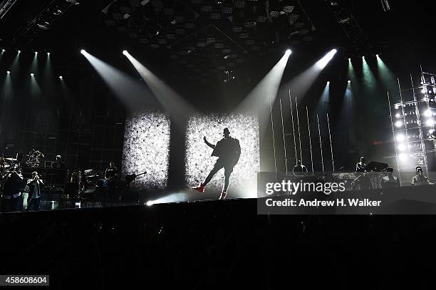 Image has been digitally processed] Usher performs at Madison Square Garden on November 7, 2014 in New York City.