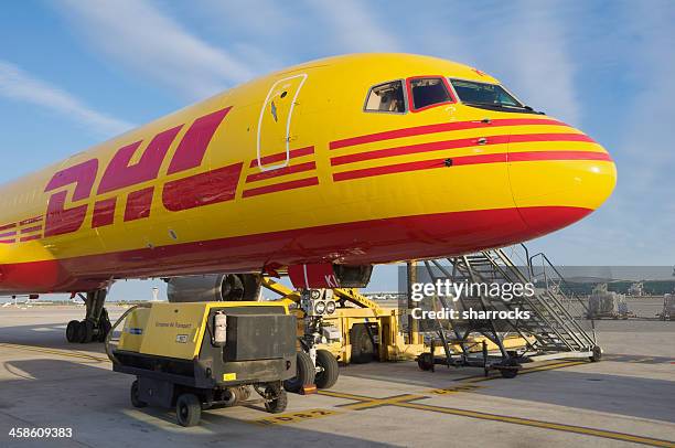 dhl boeing 757-200sf aircraft parked at barcelona airport - cargo planes at leipzig airport stock pictures, royalty-free photos & images