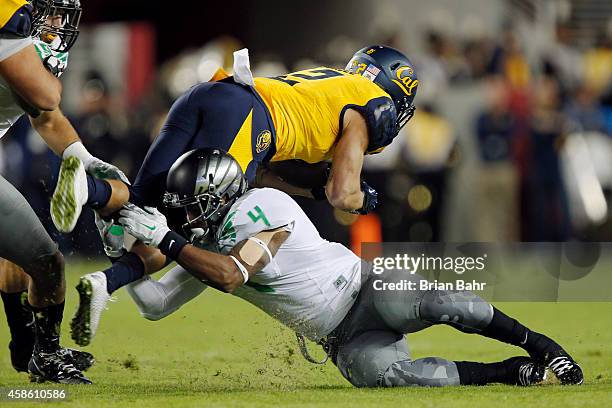 Safety Erick Dargan of the Oregon Ducks tackles running back Daniel Lasco of the California Golden Bears for a six-yard gain on the first play of the...