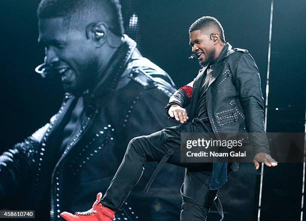 Usher performs onstage during his 'The UR Experience' tour at Madison Square Garden on November 7, 2014 in New York City.