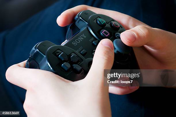 playstation wireless controller - playstation stock pictures, royalty-free photos & images