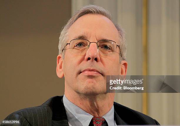William Dudley, president and chief executive officer Federal Reserve Bank of New York, listens during the International Symposium of the Bank of...