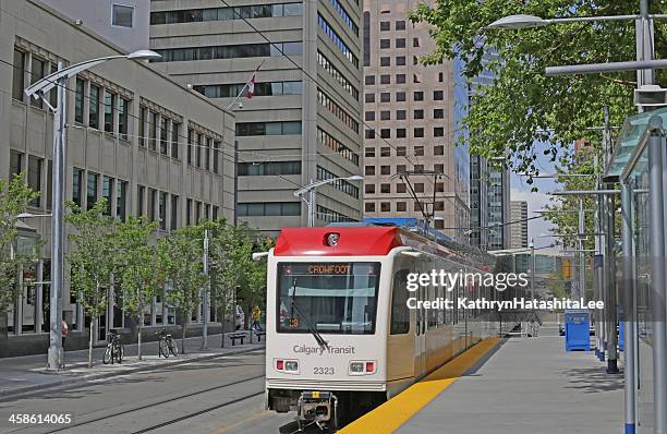 calgary's c-train 201 on 7th avenue, alberta, canada in spring - calgary ctrain stock pictures, royalty-free photos & images