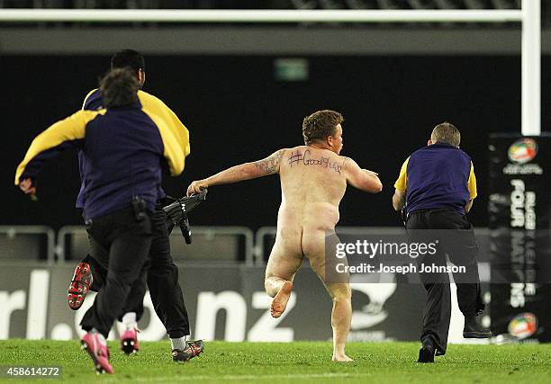 Streaker runs onto the feild in the second half during the Four Nations match between the New Zealand Kiwis and England at Forsyth Barr Stadium on...