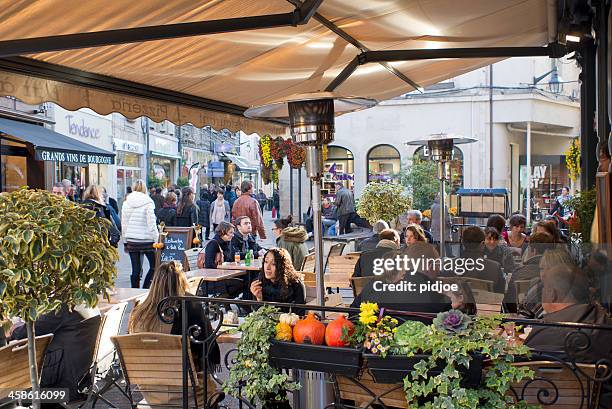 restaurant terrace on place carnot in beaune france - beaune france stock pictures, royalty-free photos & images