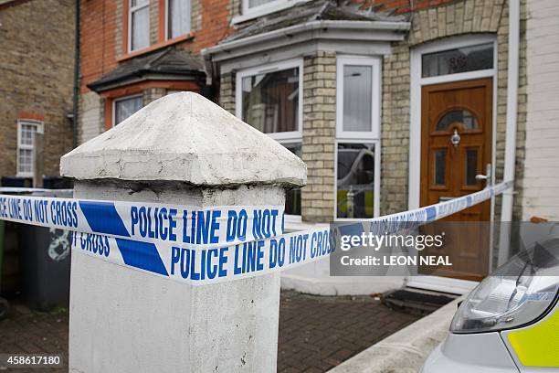 Police tape marks off the front of a residential address in High Wycombe, Buckinghamshire, north west of London, on November 8 in connection with the...