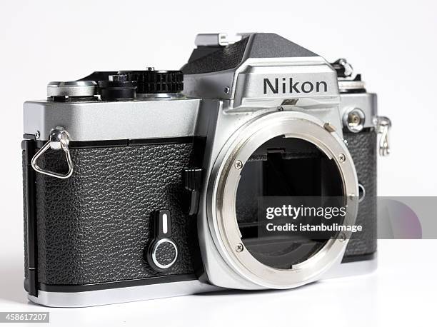 old nikon fm slr camera body - nikon stock pictures, royalty-free photos & images