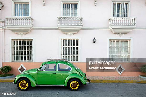 green vw beetle - old manila stock pictures, royalty-free photos & images