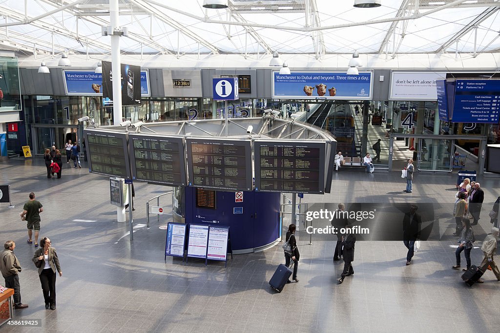 Railway station concourse and information board