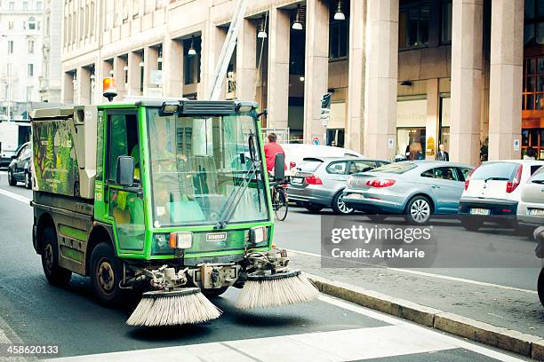 cleaning car on a milan street - road sweeper stock pictures, royalty-free photos & images