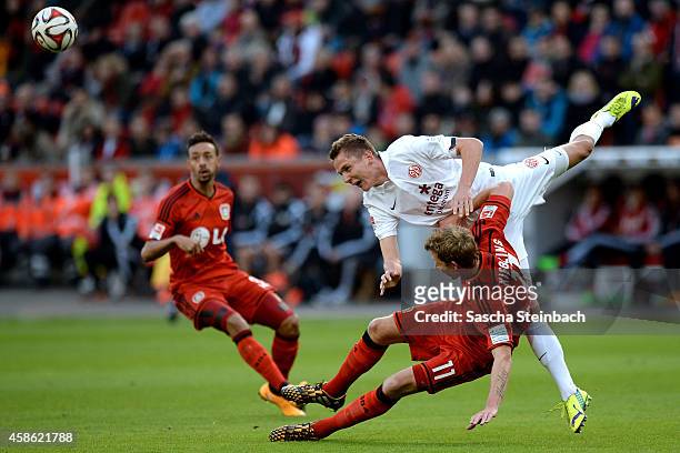 Niko Bungert of Mainz battles for the ball with Stefan Kiessling of Leverkusen during the Bundesliga match between Bayer 04 Leverkusen and 1. FSV...