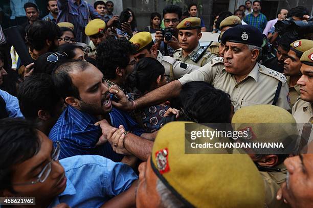 Police intervene as right-wing Hindu religious group activists prevent Indian youths from kissing each other during a rally for the 'Kiss of Love'...