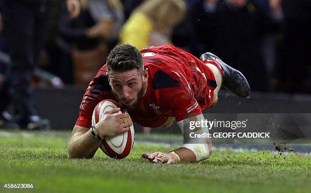 Wales' wing Alex Cuthbert scores a try during the International rugby union test match between Wales and Australia at the Millennium Stadium in...