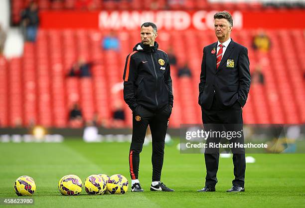 Manchester United Manager Louis van Gaal looks on with his Assistant Ryan Giggs prior to the Barclays Premier League match between Manchester United...