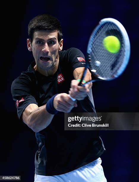 Novak Djokovic of Serbia plays a backhand in practice during the Barclays ATP World Tour Finals tennis previews at the O2 Arena on November 8, 2014...