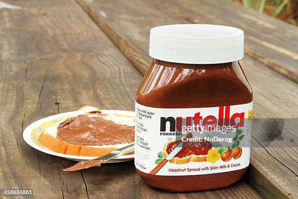 nutella hazelnut and cocoa spread - nutella stock pictures, royalty-free photos & images