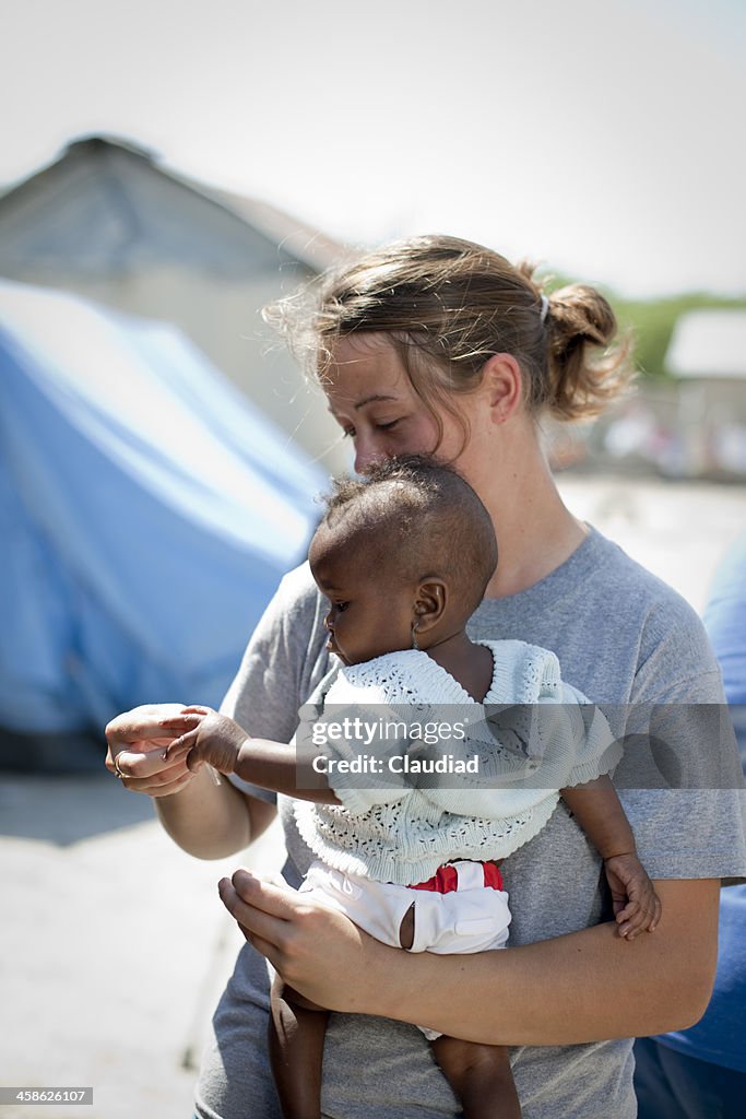 Aid worker with baby