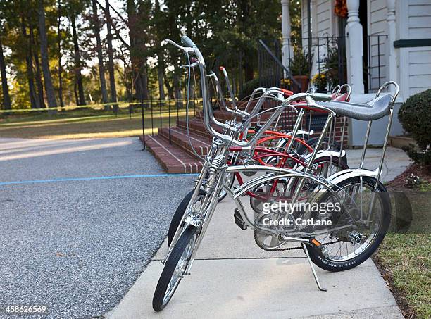 row of vintage schwinn stingray bikes - sports roadster stock pictures, royalty-free photos & images