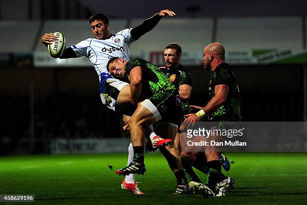 Matt Banahan of Bath is tackled by Sam Hill of Exeter Chiefs during the LV= Cup match between Exeter Chiefs and Bath Rugby at Sandy Park on November...