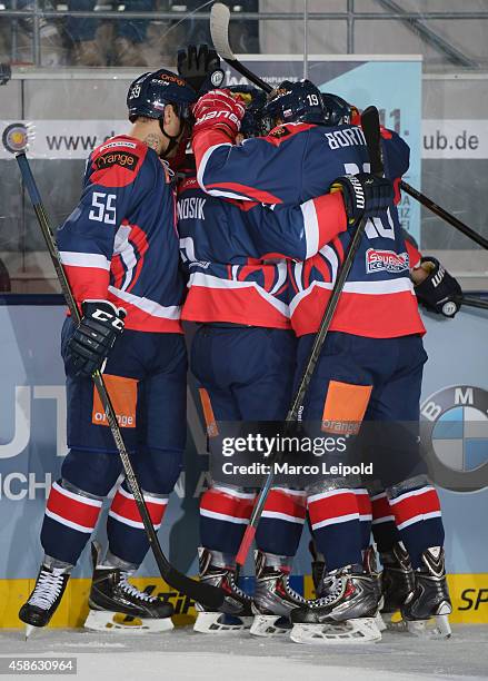 Oldrich Kotvan, Adam Vanosik and Dalibor Bortnak of Team Slovakia celebrate during the game between Germany and Slovakia on November 8, 2014 in...