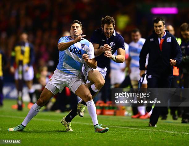 Alex Dunbar of Scotland is tackled by Juan Imhoff of Argentina during the International match between Scotland and Argentina at Murrayfield Stadium...
