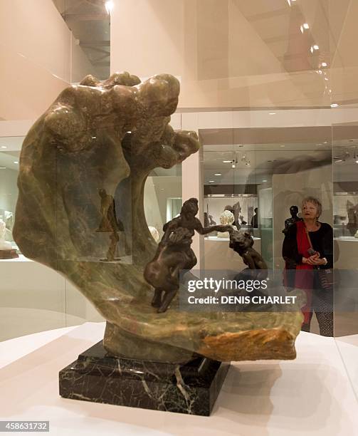 Woman looks at a sculpture at La Piscine museum in Roubaix, northern France, on November 8 during an exhibition to mark the 150th anniversary of the...