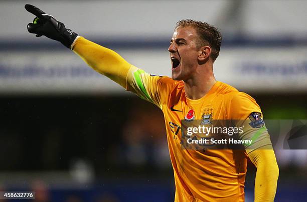 Joe Hart of Manchester City shouts during the Barclays Premier League match between Queens Park Rangers and Manchester City at Loftus Road on...