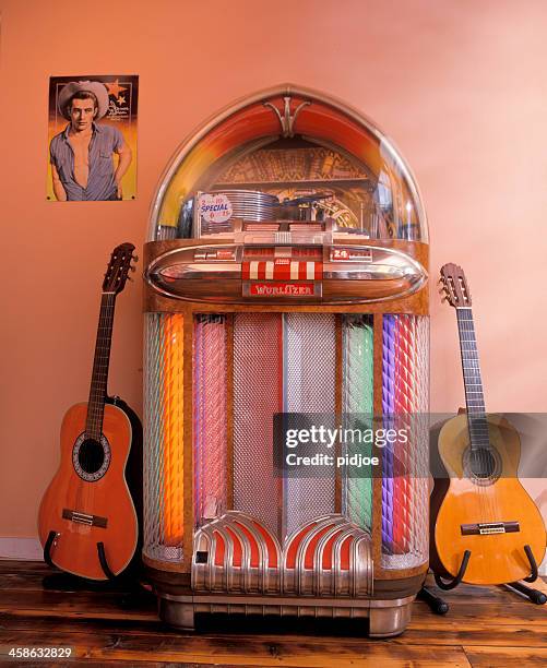 wurlitzer jukebox and two guitars - jukebox stock pictures, royalty-free photos & images