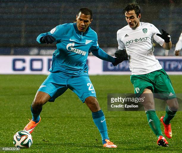 Salomon Rondon of FC Zenit St. Petersburg and Mauricio of FC Terek Grozny vie for the ball during the Russian Football League Championship match...
