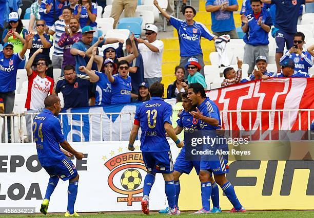 Mathias Corujo of U de Chile celebrates with teammates after scoring the opening goal during a match between Cobreloa and U de Chile as part of round...