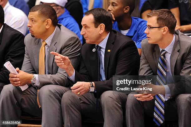 Associate Head Coach Jeff Capel, Head Coach Mike Krzyzewski and Assistant Coach Jon Scheyer of the Duke Blue Devils look on during their game against...