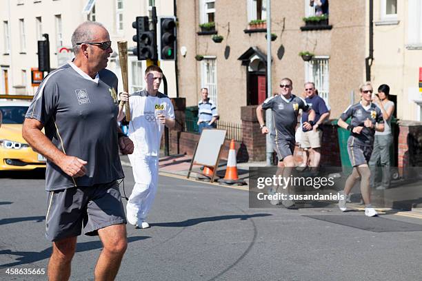 olympic torch security - south wales stock pictures, royalty-free photos & images