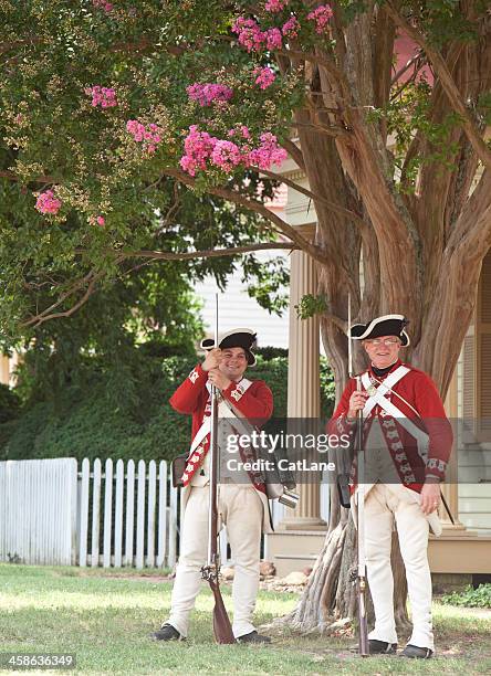 red coats resting in shade - colonial williamsburg stock pictures, royalty-free photos & images