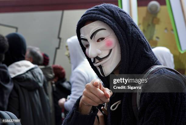 anti-acta protest - guy fawkes mask stock pictures, royalty-free photos & images