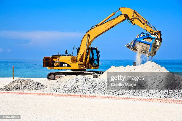 beach renourishment - caterpillar inc stock pictures, royalty-free photos & images